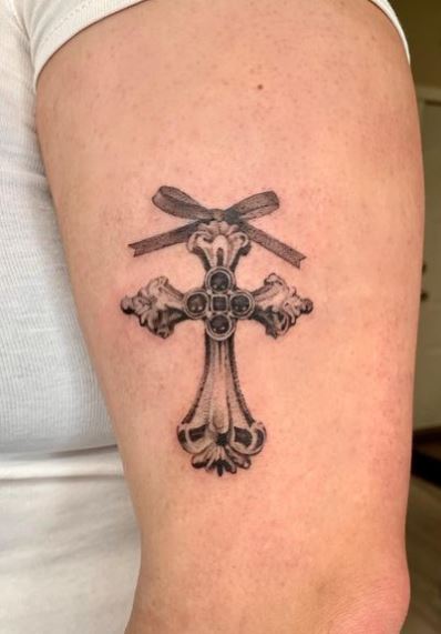Black and Grey Bow and Ornamented Cross Biceps Tattoo