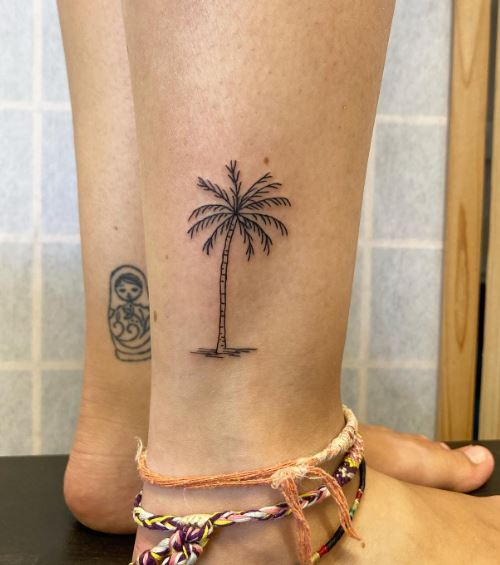 Black Minimalistic Palm Tree Ankle Tattoo