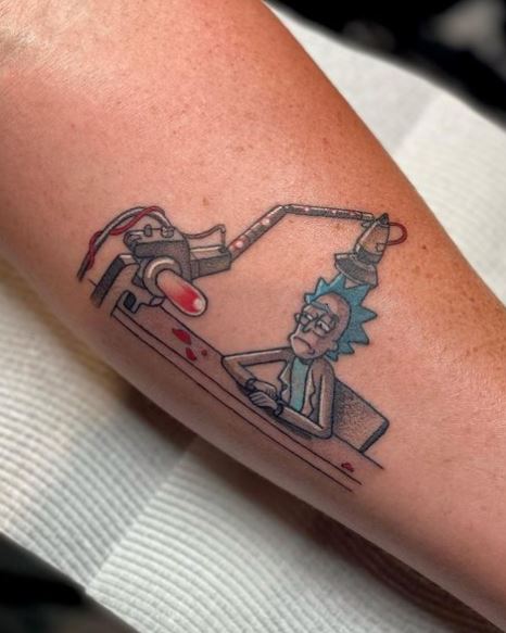 Depressed Rick Sitting on Desk Forearm Tattoo