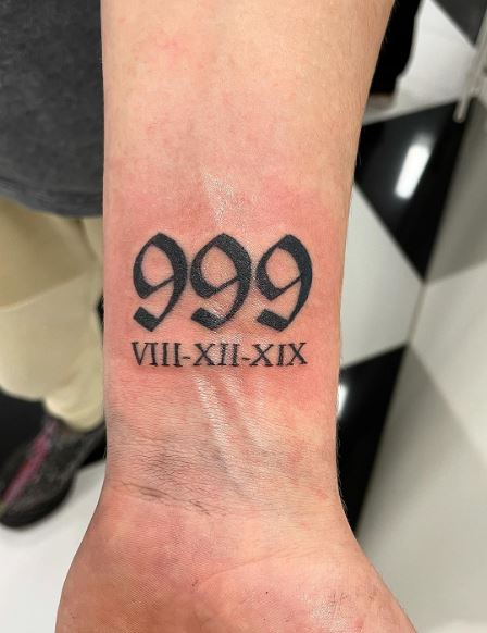 Black Roman Numbers and 999 Wrist Tattoo