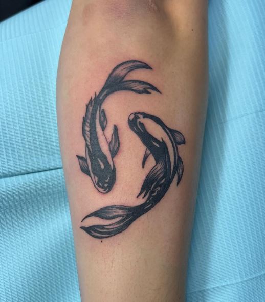 Black Koi Fishes Forearm Tattoo
