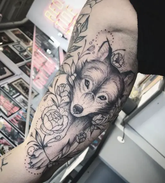 Flowers and Wolf Inner Biceps Tattoo