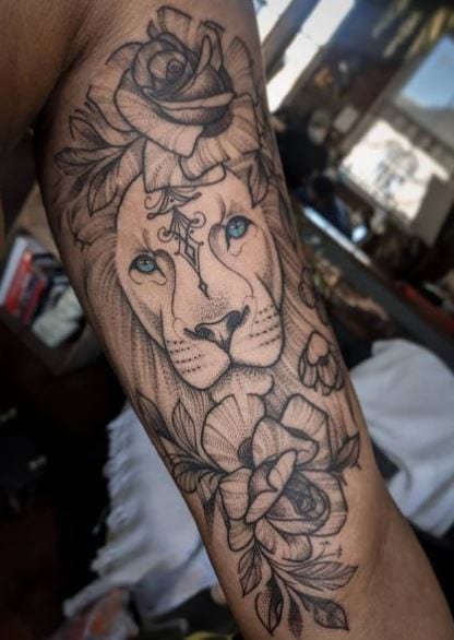 Roses and Lion Inner Biceps Tattoo