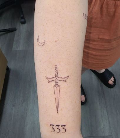 Crescent, Dagger and 333 Angel Number Forearm Tattoo