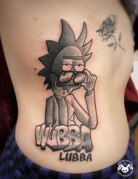 Rick with Glasses and Script Ribs Tattoo