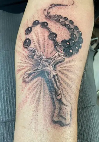 Black and Grey Rosary with Jesus Forearm Tattoo
