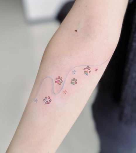 Colorful Cat's Paw Print Forearm Tattoo