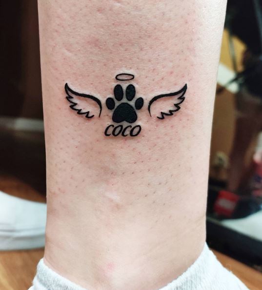 Black Paw with Halo and Angel Wings Ankle Tattoo