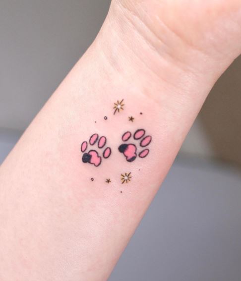 Stars and Pink Paw Print Wrist Tattoo