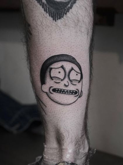 Black and Grey Morty Smith Calf Muscle Tattoo