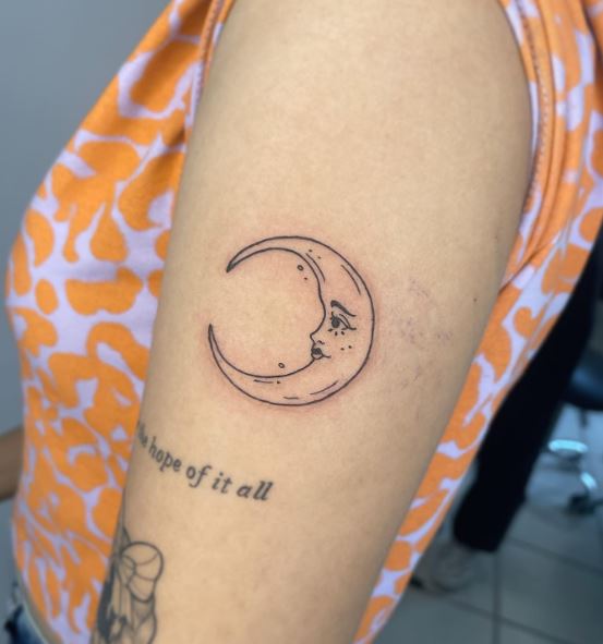 Half Moon with Face Biceps Tattoo