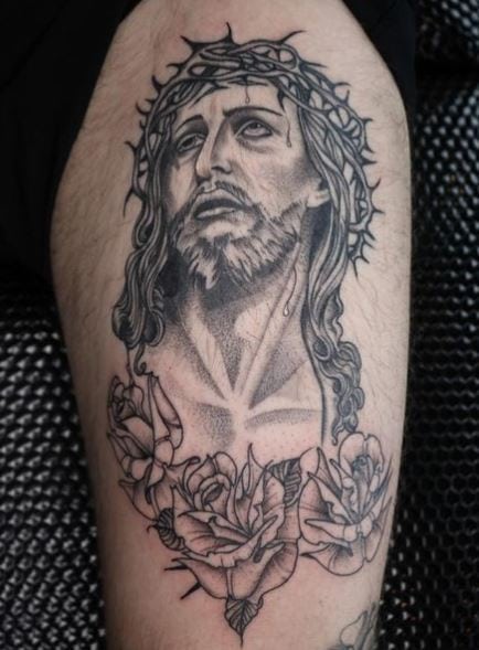 Black and Grey Roses and Jesus Christ Arm Tattoo