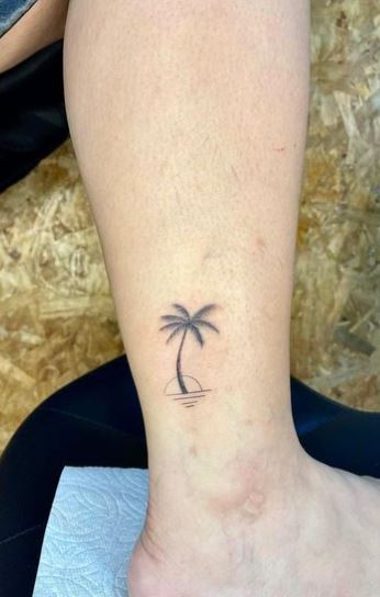 Sun and Palm Tree by the Ocean Ankle Tattoo