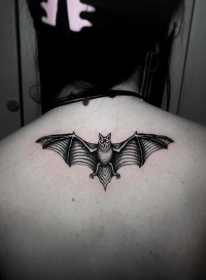 Black and Grey Gothic Flying Bat Spine Tattoo