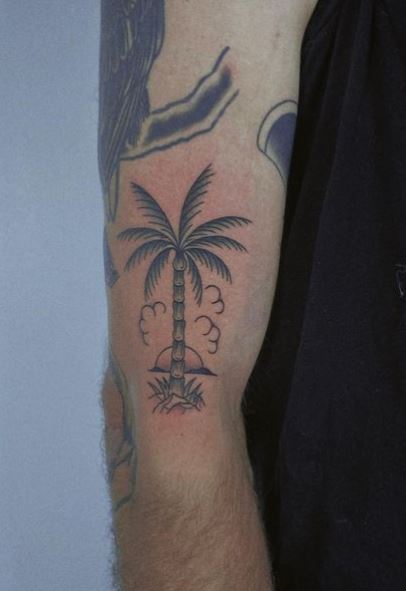 Sun with Clouds and Palm Tree by the Ocean Arm Tattoo