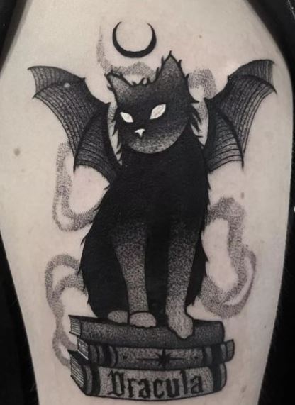 Books and Black Gothic Cat with Wings Arm Tattoo