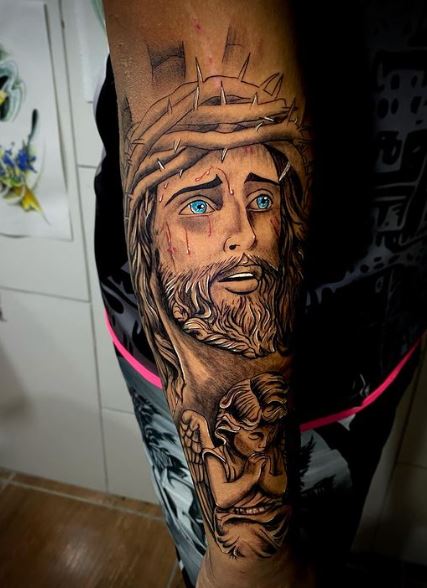 Angel and Jesus Christ Forearm Tattoo