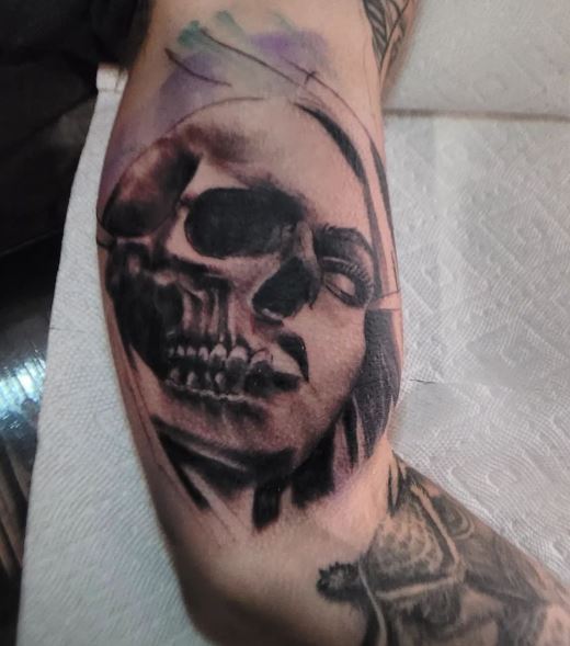 Woman Face and Skull Inner Biceps Tattoo