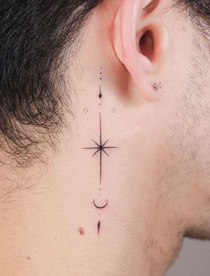 Ornament and Star Behind Ear Tattoo
