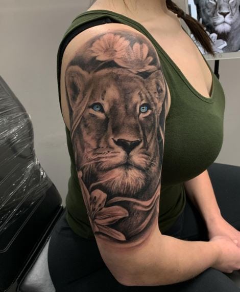 Flowers and Lioness with Blue Eyes Arm Half Sleeve Tattoo