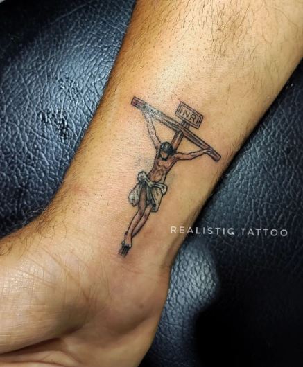 Colored Minimalistic Crucifixion Wrist Tattoo