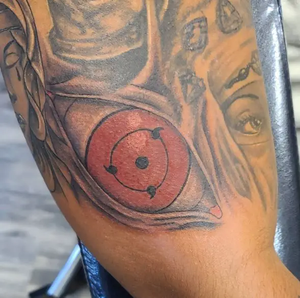 Grey and Red Itachi Sharingan Biceps Tattoo