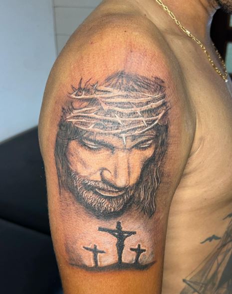 Jesus and Crucifixion Arm Tattoo