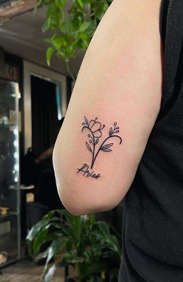 Flowers and Aries Zodiac Sign Arm Tattoo