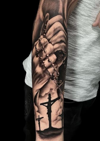 Praying Hands and Crucifixion Forearm Sleeve Tattoo