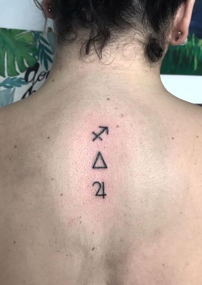 Symbols and Sagittarius Zodiac Sign Spine Tattoo