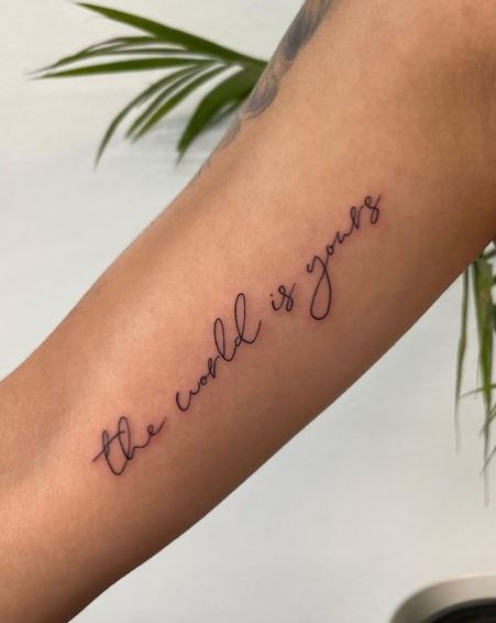 The World Is Yours Script Inner Biceps Tattoo