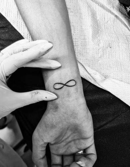 Black Infinity Symbol Wrist Tattoo