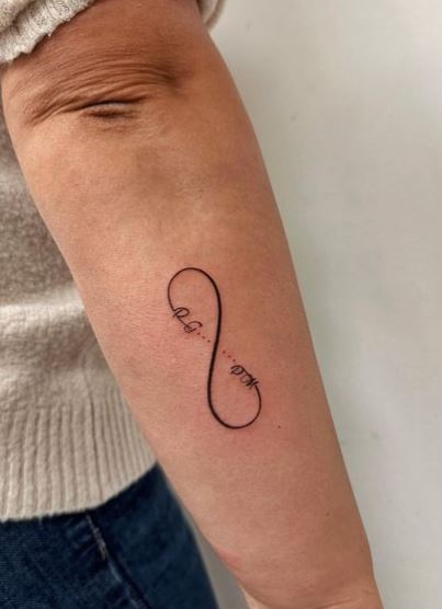 Black Infinity Symbol with Letters Forearm Tattoo