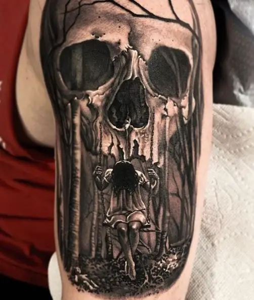 Girl on Swing and Gothic Skull Arm Tattoo