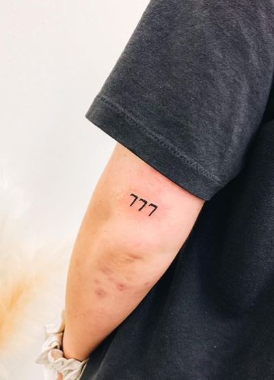 Minimalistic 777 Angel Number Elbow Tattoo