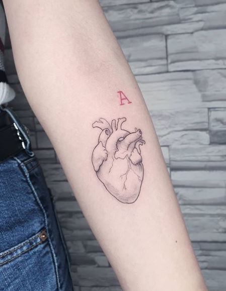 Grey Realistic Heart Forearm Tattoo