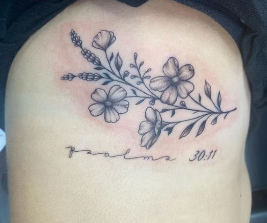 Flowers and Psalm 30:11 Bible Verse Ribs Tattoo