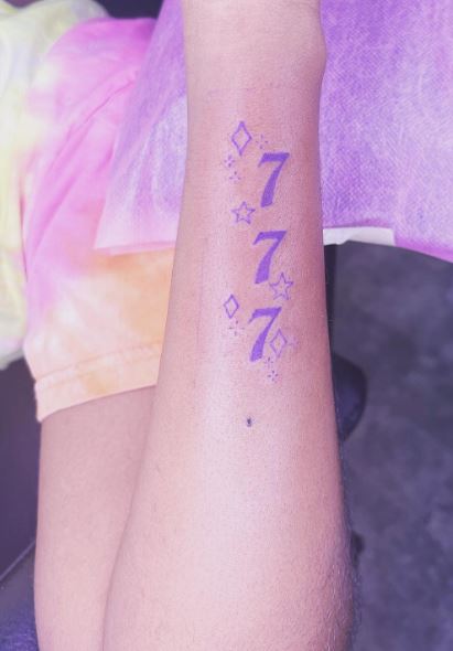 Blue Stars and 777 Angel Number Forearm Tattoo