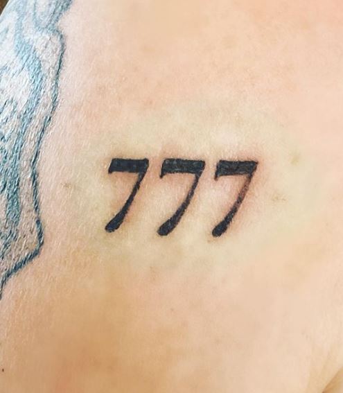 Minimalistic 777 Angel Number Shoulder Tattoo