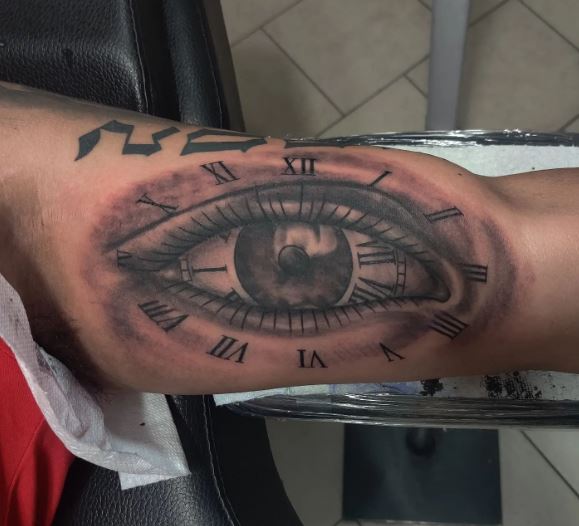 Eye and Clock with Roman Numbers Inner Biceps Tattoo