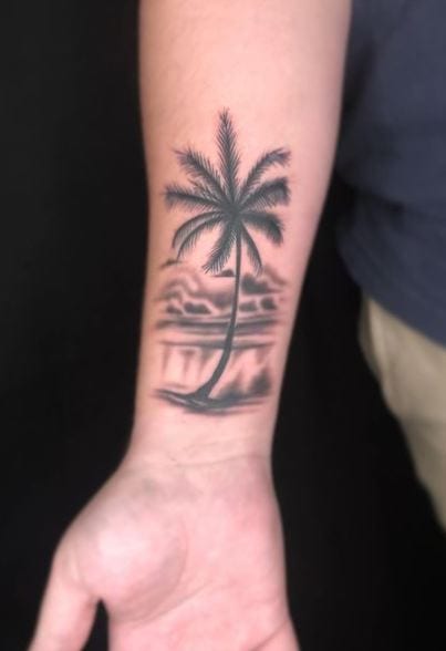 Grey Ocean Landscape and Palm Tree Forearm Tattoo