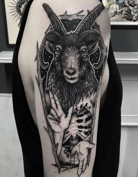 Hands and Goat with Four Eyes Occult Arm Tattoo