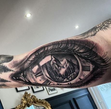 Eye and Clock with Mountain Background Inner Biceps Tattoo