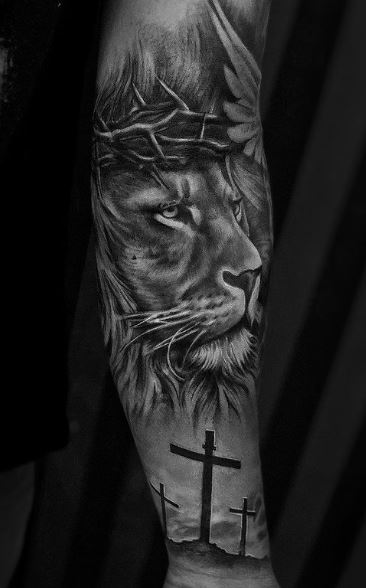 Crucifixion and Lion of Judah Arm Sleeve Tattoo