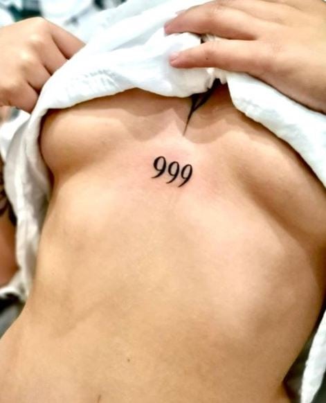 Black 999 Angel Number Stomach Tattoo