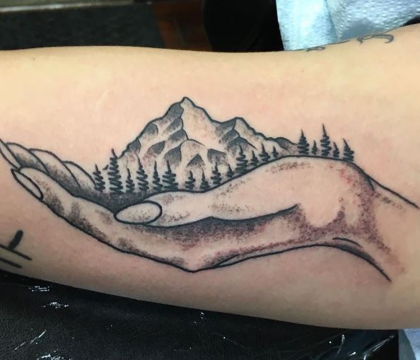Holding Hand and Mountain Landscape Inner Biceps Tattoo