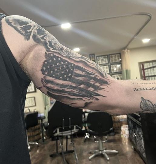 Ripped USA Flag Inner Biceps Tattoo