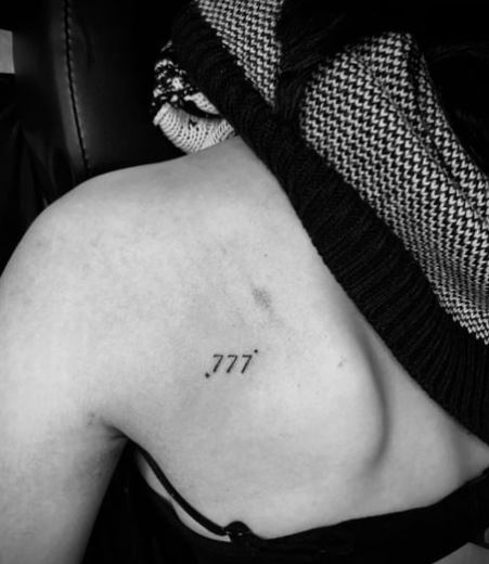 Black 777 Angel Number Back Tattoo