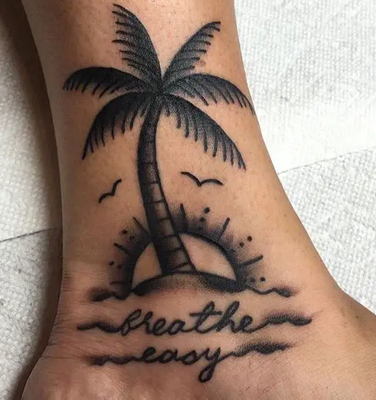 Black and Grey Sunset and Traditional Palm Tree with Script Ankle Tattoo