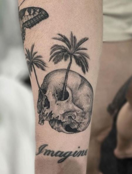 Black and Grey Skull and Palm Trees Arm Tattoo